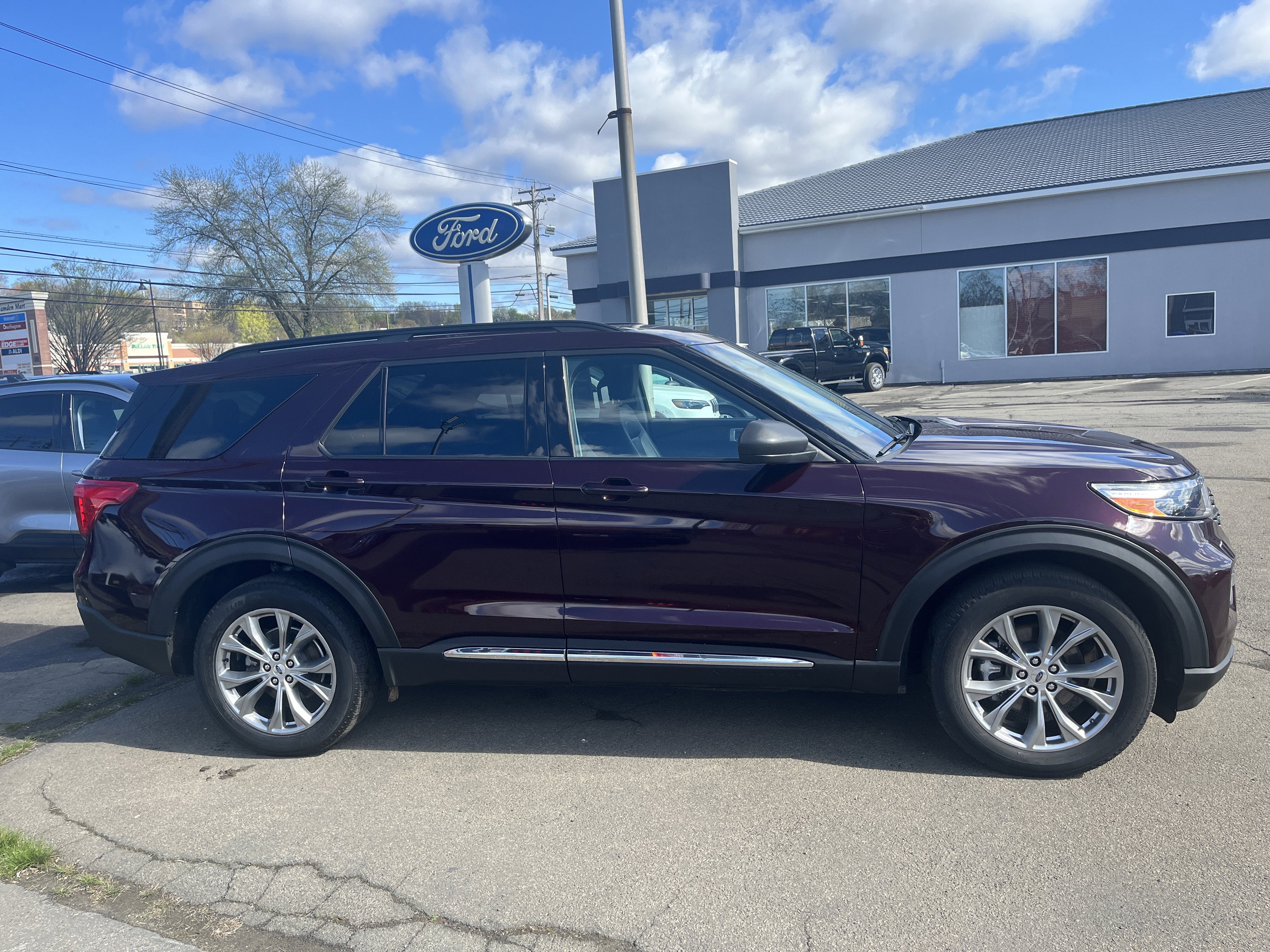 2023 Ford Explorer XLT in Jewel Red Met Tin — front three-quarter view