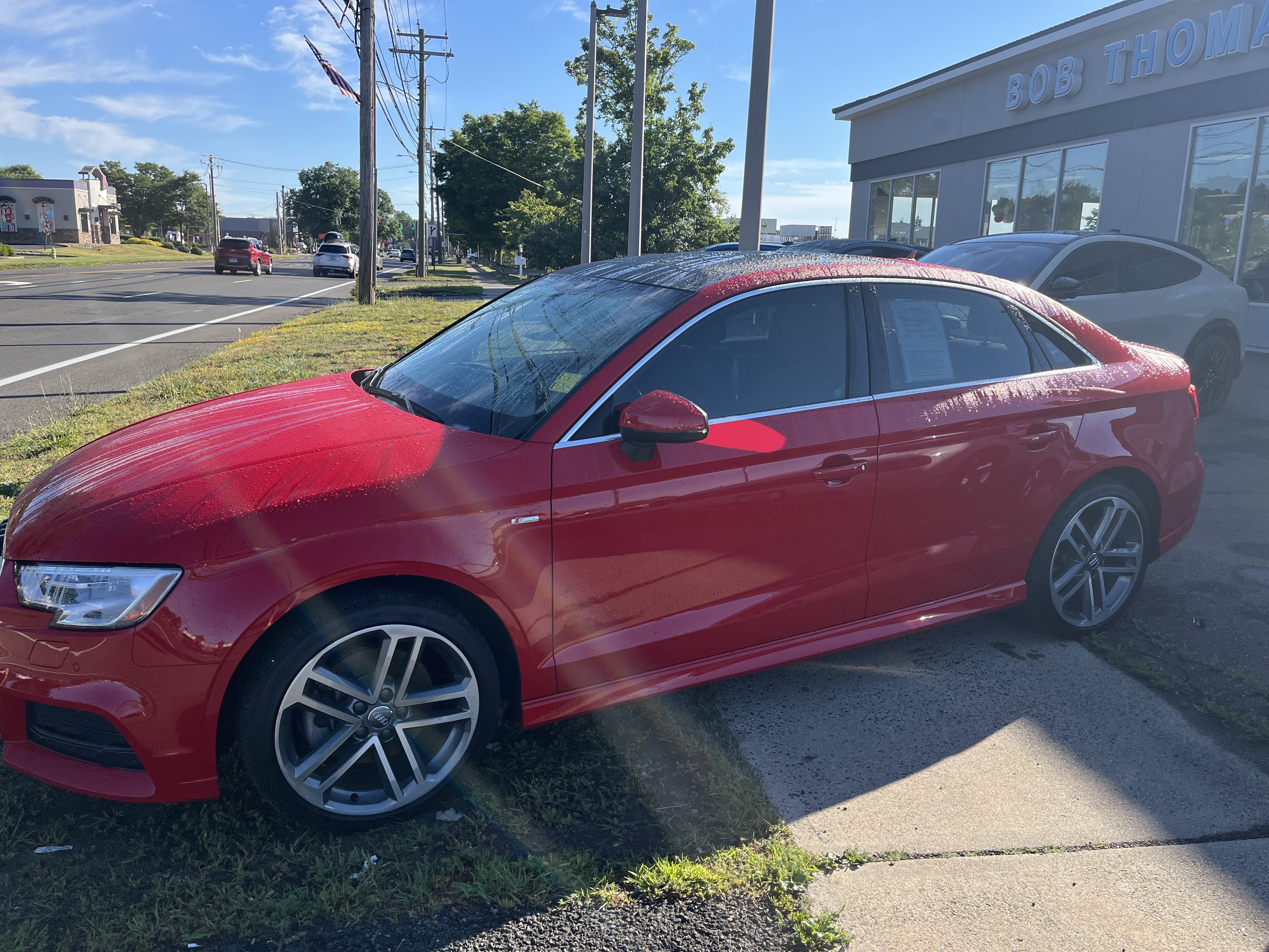 2018 Audi A3 Sedan 2.0T quattro Premium Plus in Red — front three-quarter view