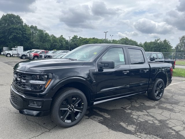 2026 Ford F-150 STX in Agate Black Metallic — front three-quarter view