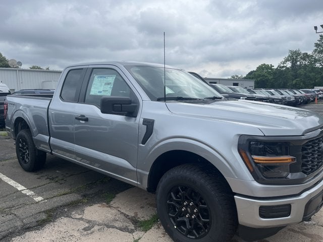 2026 Ford F-150 STX in Iconic Silver Metallic — front three-quarter view