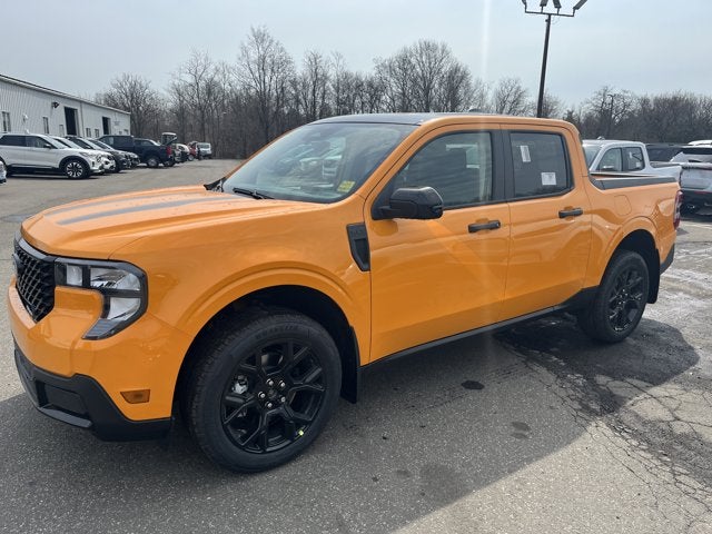 2026 Ford Maverick XLT in Oran Fury Met T — front three-quarter view